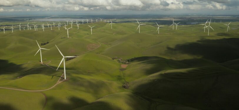 windmills in grassy fields.
